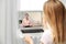 Woman using laptop at home for online consultation with psychologist via video chat