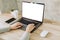 Woman using laptop and working on wooden table