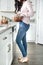 Woman using a mixer in the kitchen