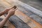 Woman using mobile phone on wooden table, copy space for use advertise and presentation