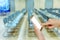 Woman using mobile smart phone with blurry chair in auditorium b