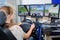 Woman using multi screened driving simulator