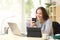 Woman using multiple devices at home