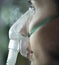 Woman using nebuliser mask