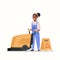 Woman using professional washing machine african american female cleaner janitor in uniform near wet floor sign cleaning