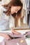 Woman using scissors to cut fabric