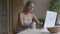 Woman using social media on laptop