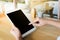 Woman using tablet in coffee shop in the moring