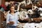 Woman using tablet in fabric storage warehouse, portrait