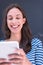 Woman using tablet in front of chalk drawing board