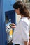 Woman using ticket machine