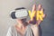 Woman using virtual reality headset, mixed media