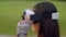 Woman using virtual reality headset in park. Asian woman wearing VR glasses