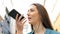 Woman is using voice recognition on smart phone
