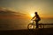 Woman on vacation biking at beach