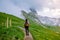 Woman on vacation hiking in the Italien Dolomites, Amazing view on Seceda peak. Trentino Alto Adige, Dolomites Alps