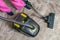 Woman is vacuuming carpet with vacuum cleaner