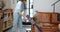 Woman vacuuming floor with cordless cleaner