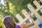 Woman varnishing a new wooden fence