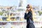 Woman at Versailles Palace. Young french dressed tourist girl admiring the views. Portrait soft bokeh background