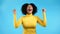 Woman is very glad, she screaming loud, sincere rejoices. Afro girl trying to get attention. Concept of sales