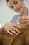 Woman vet applying tick prevention to dog\'s hair
