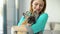 Woman veterinarian doctor with little french bulldog in vet clinic after examination. Pet care concept