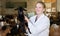 Woman veterinarian looking after little goats