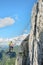 Woman on via ferrata Intersport Klettersteig in Donnerkogel mountains, Austria