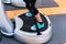 Woman on vibrating plates in gym training