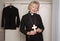 Woman vicar holding a wooden cross