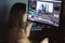 Woman video montager mounts video at desktop. Home workstation