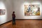 Woman views paintings of New Tretyakov Gallery