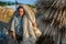 A woman from the village is carrying wet jute on her shoulder to dry at flood-affected areas