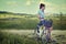 Woman with vintage bike outdoor, summer Tuscany