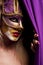 woman in violet party mask