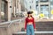 Woman in a virtual reality helmet walks down the street