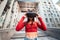 Woman in a virtual reality helmet walks down the street