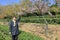 Woman visit the light pink cerasus serrulata in the tea gardens, adobe rgb