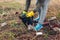 Woman volunteer cleaning up the trash in park. Picking up rubbish outdoors. Ecology and environment concept