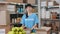 Woman in volunteer t-shirt posing at food bank