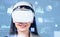 Woman in vr glasses, data blocks in cyberspace, forex diagrams and virtual reality