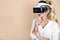 Woman with VR glasses of virtual reality. Young girl in virtual augmented reality helmet. VR headset.