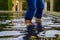 Woman Wading in Pond at Hamilton Gardens, New Zealand