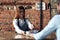 woman waiter brings coffee to a cafe client