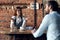 woman waiter brings coffee to a cafe client