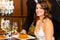 woman and waiter in fine dining restaurant