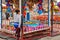 Woman waiting for customers at duck fishing Stand, Luna Park, Coney Island, NYC