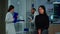 Woman waiting doctor sitting on chair in neurological research lab