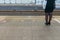 A woman waiting sky train on the floor